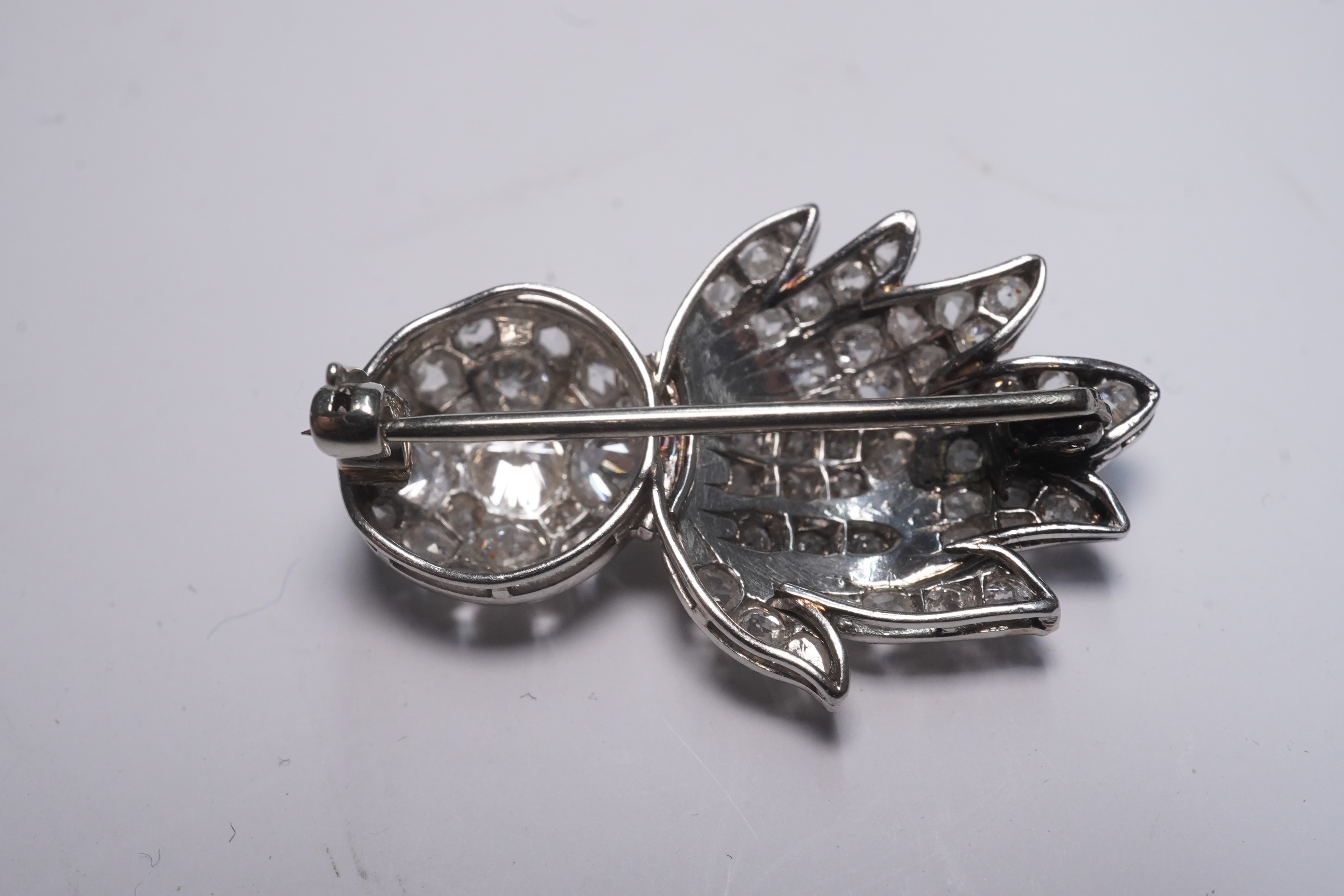 A mid 20th century white gold and pave set diamond Royal Fusiliers sweetheart brooch